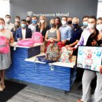 NORTHWESTERN-MUTUAL employees with backpacks for foster kids